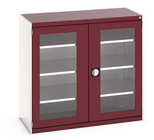 40022058.** Bott Cubio Window Door Cupboard with lockable doors and clear perspex windows. External dimensions are 1300mm wide x 650mm deep x 1200mm high and the cupboard is supplied with 3 x 160kg capacity shelves....